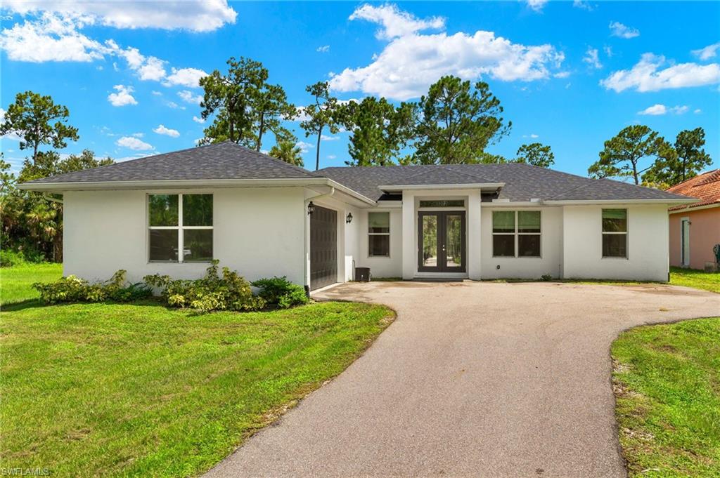 front view of a house with a yard