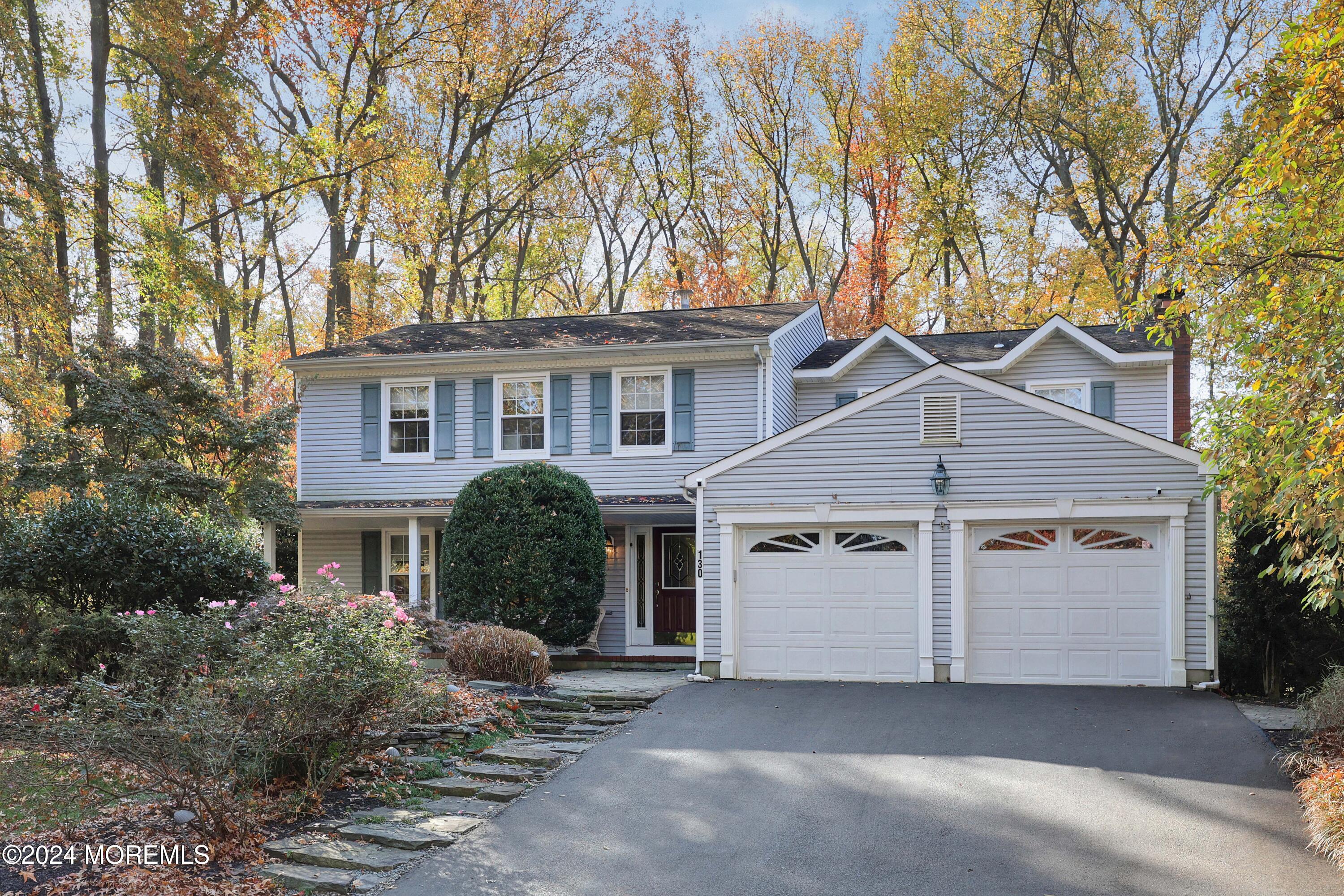 front view of a house with a tree