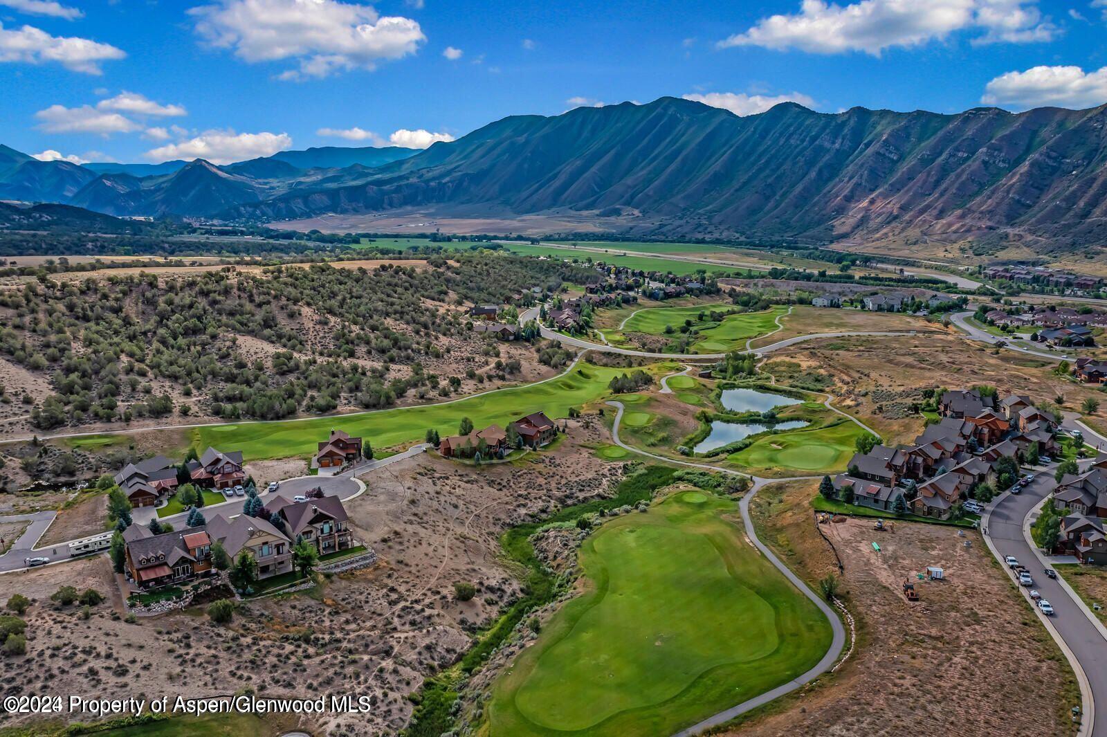 a view of a golf course with a garden