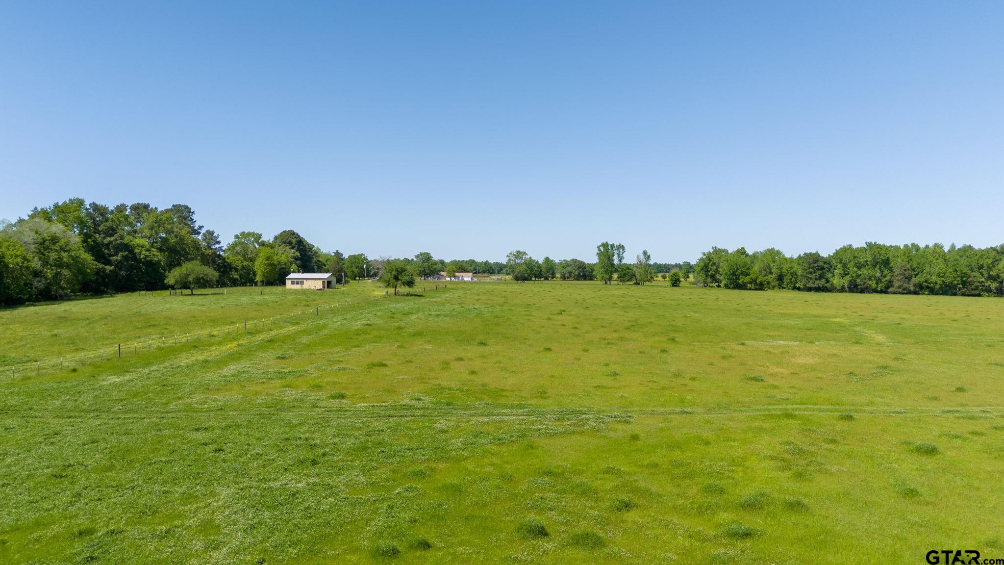 a view of a lake with a big yard