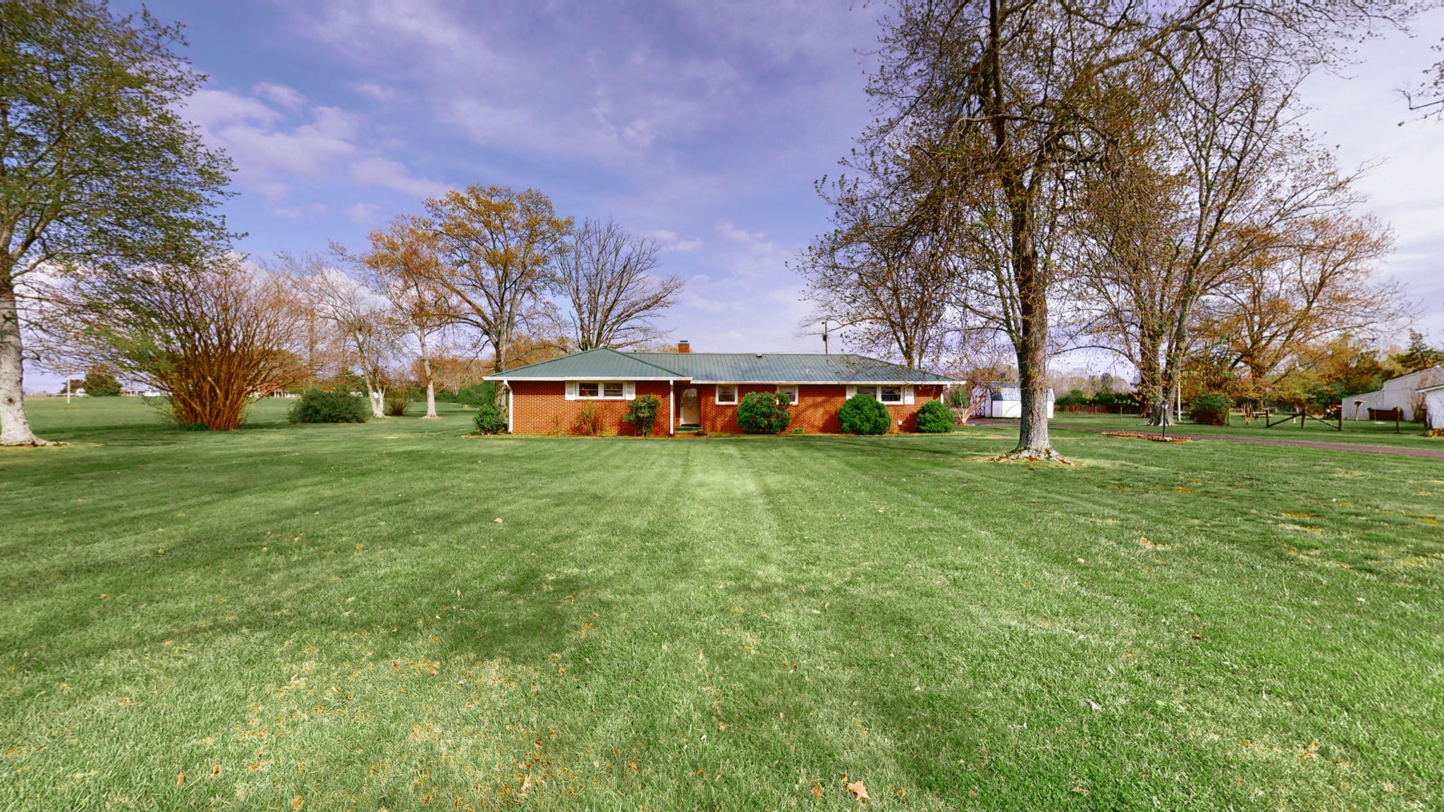 a view of a house with a big yard