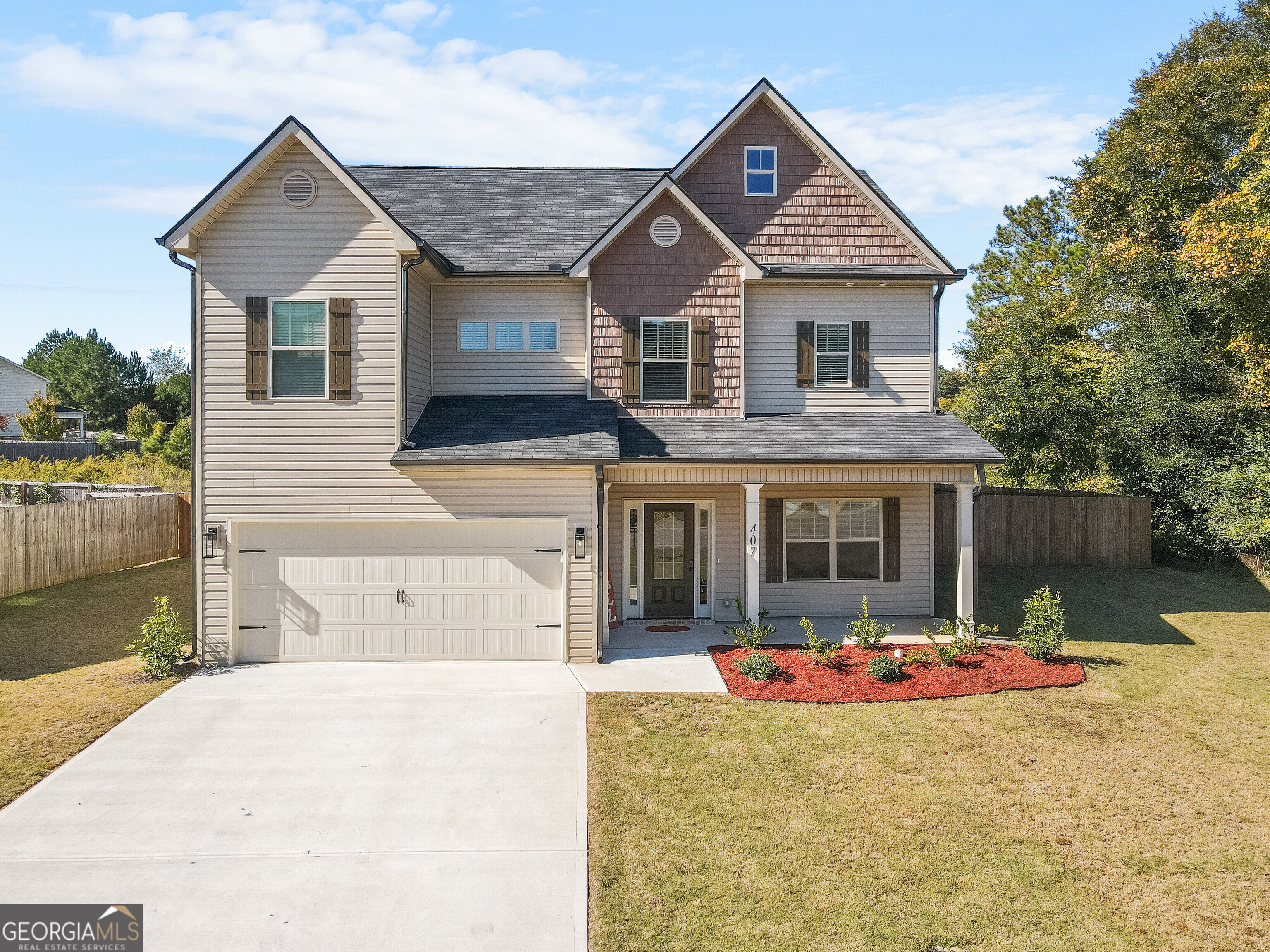 a front view of a house with yard