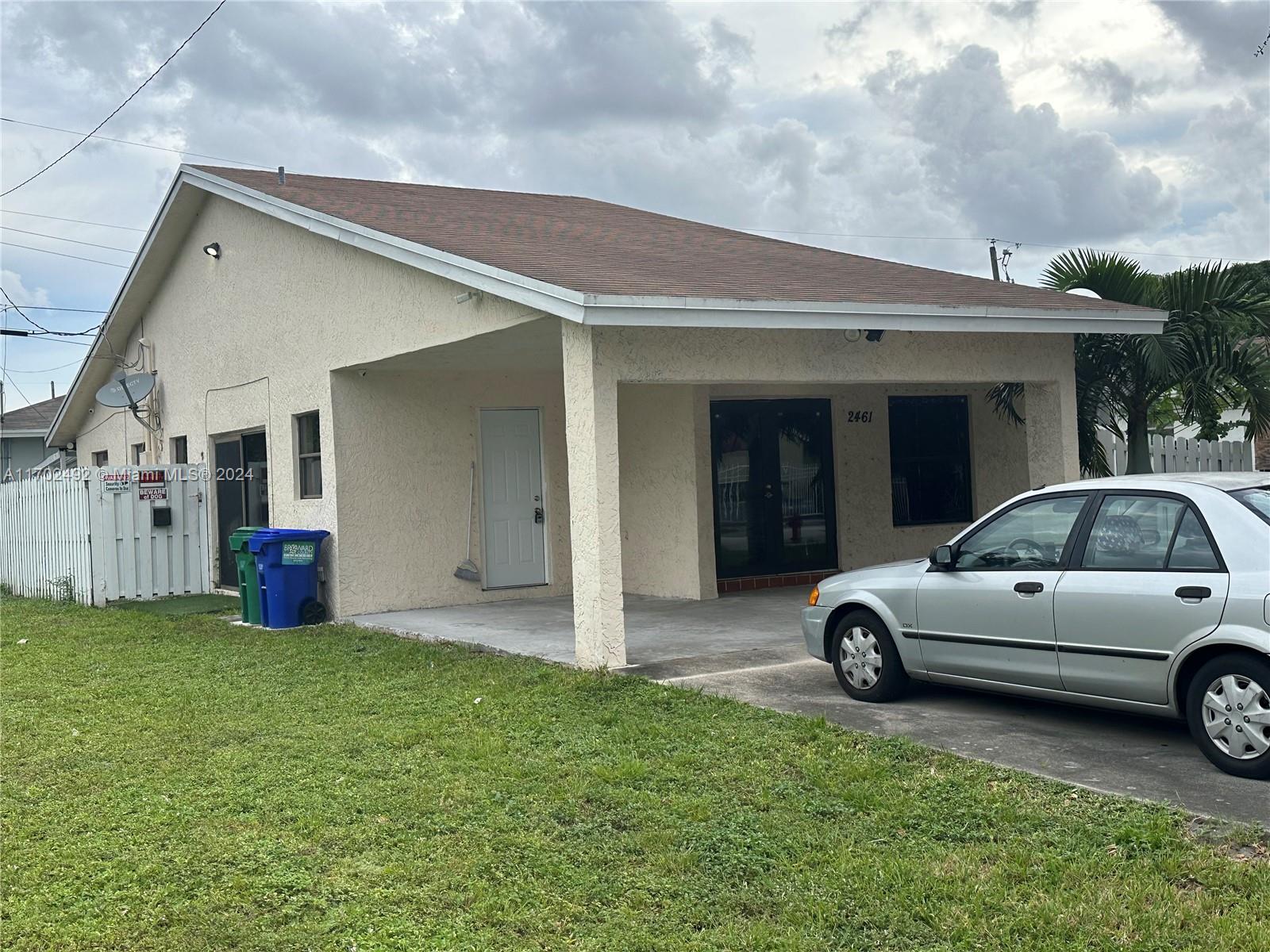 a view of a car parked in front of house