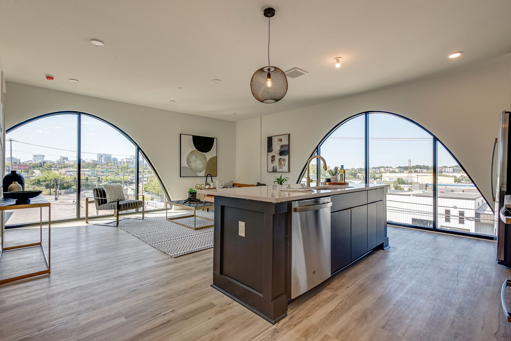 a view of living room with wooden floor and outdoor space