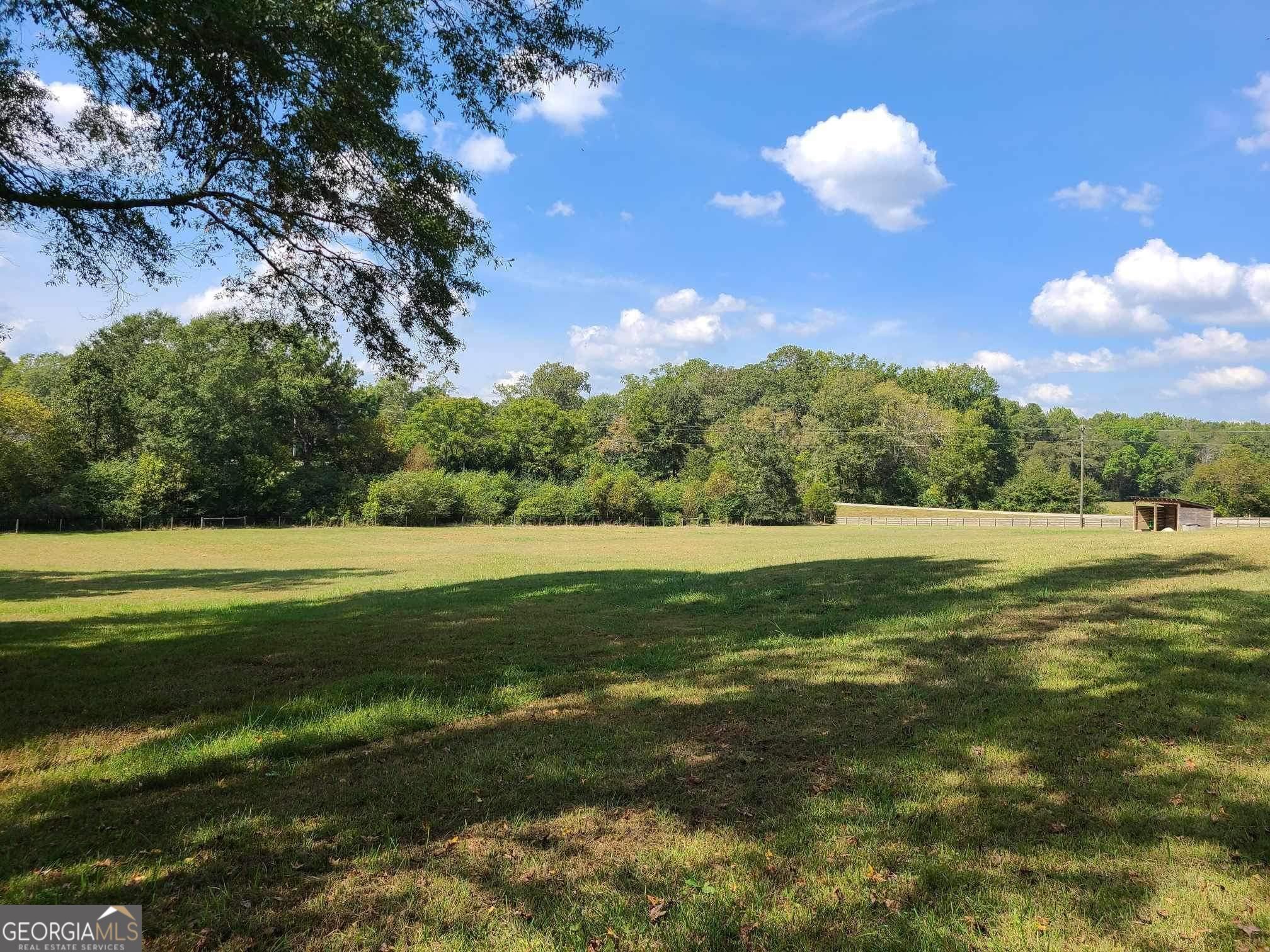 a view of a golf course with a lake