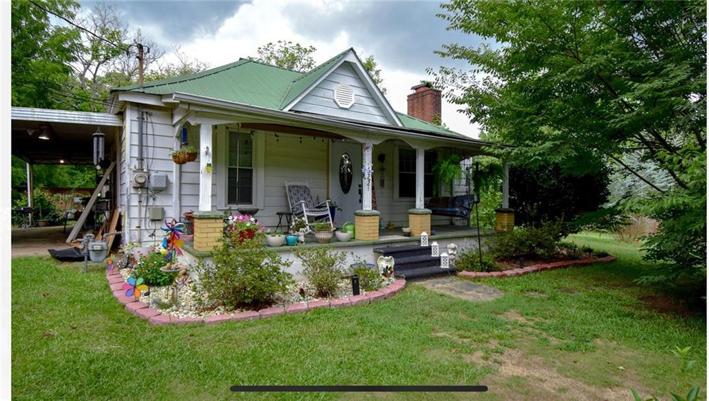 a front view of a house with garden