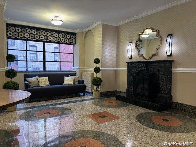 a living room with furniture a window and a fireplace