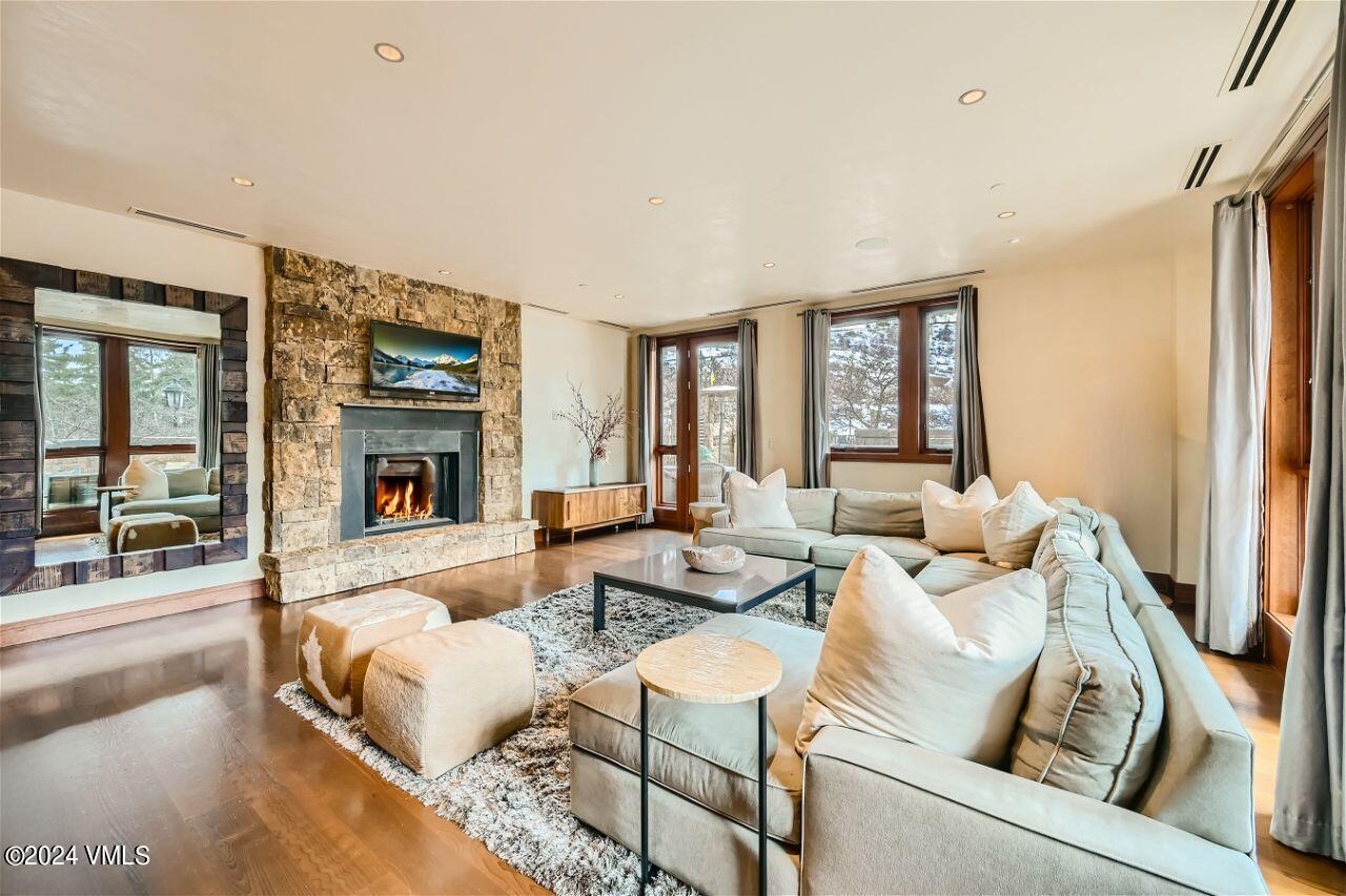 a living room with furniture and a fireplace