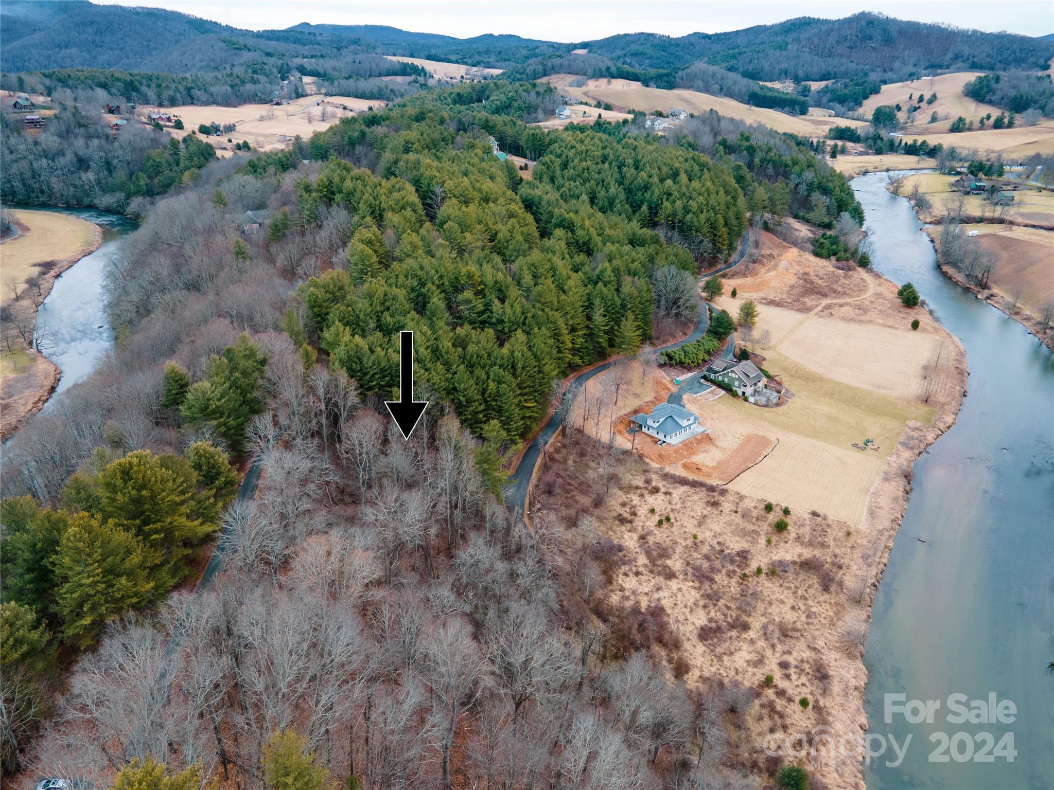 an aerial view of a house with mountain view