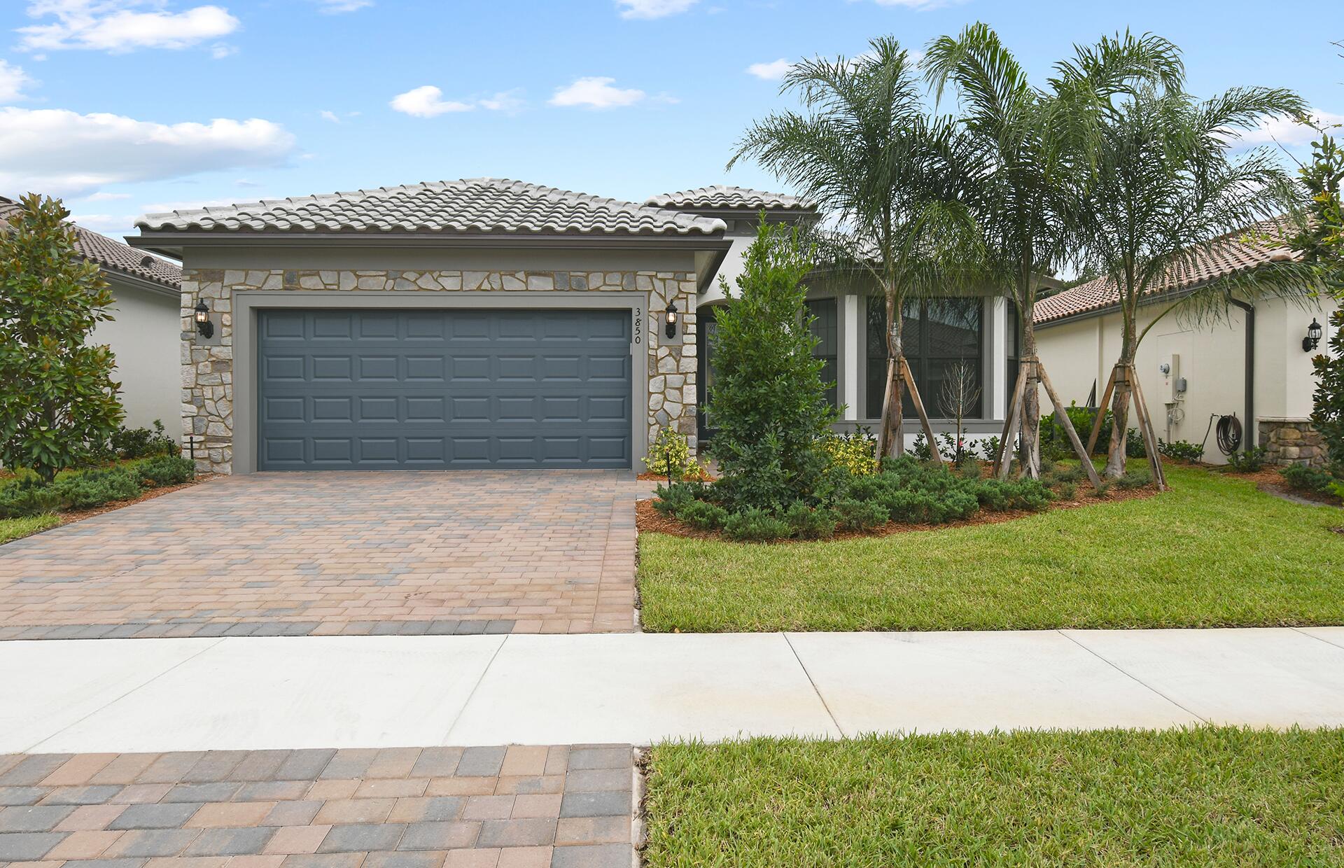 front view of a house with a yard