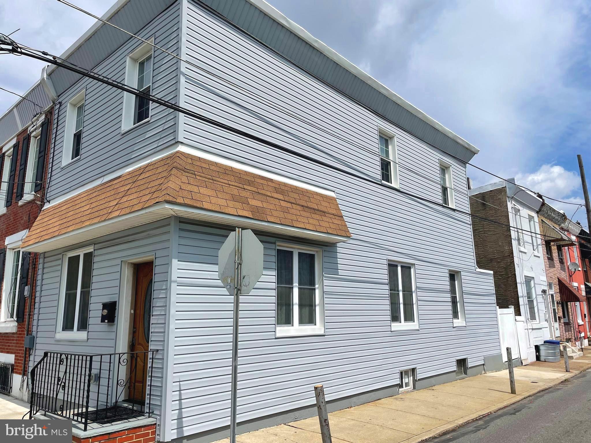 a view of a house with a street