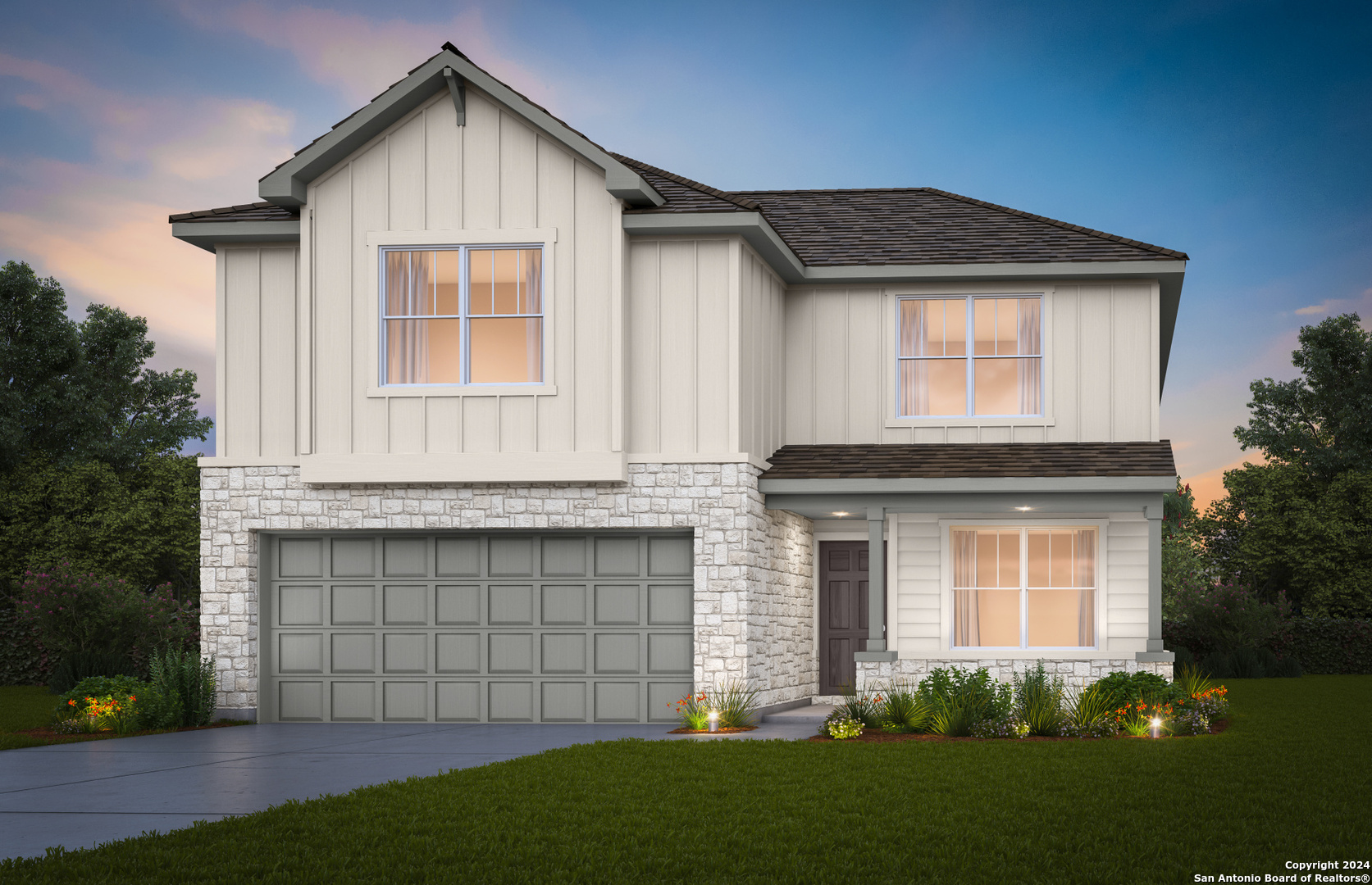 a front view of a house with a yard and garage