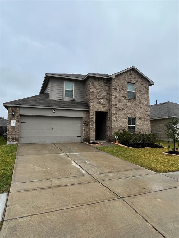 a front view of a house with yard