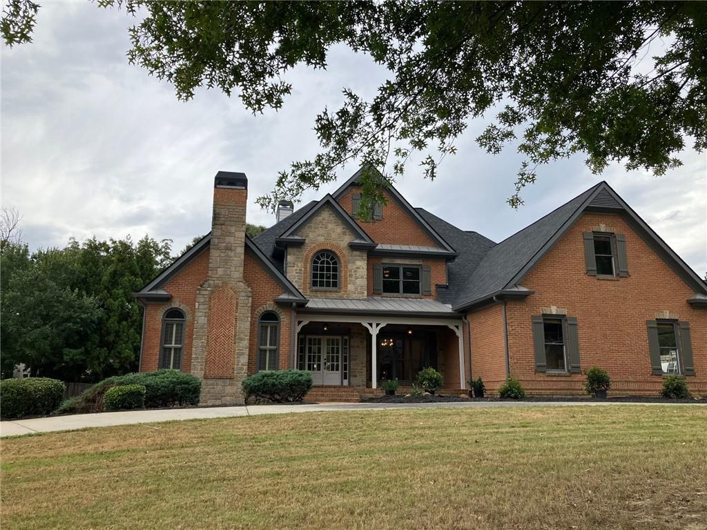 a front view of a house with a yard