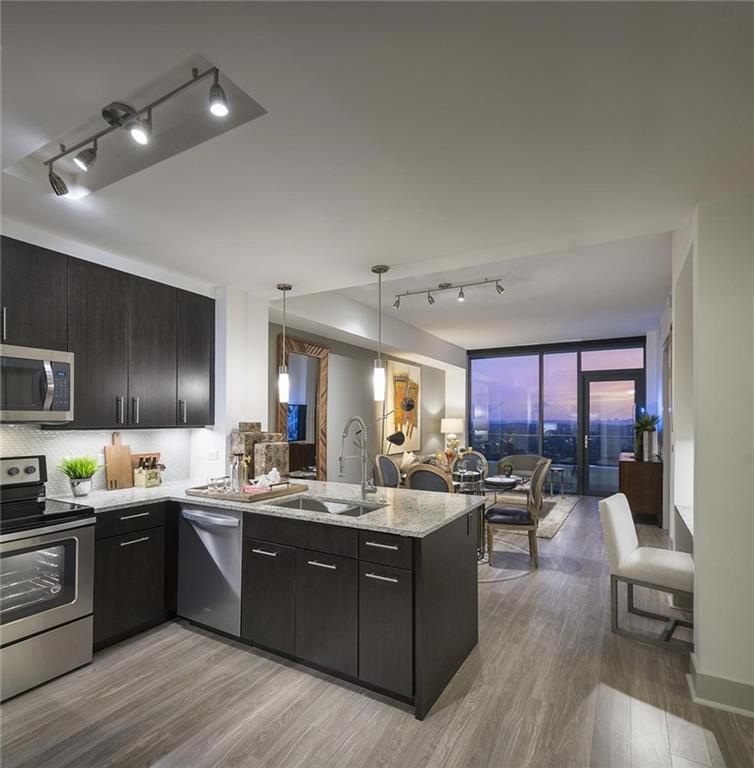 a kitchen with a sink stove and cabinets