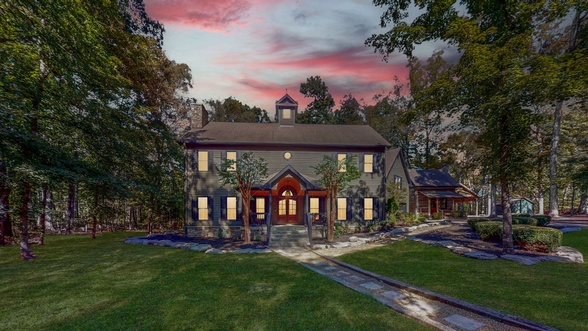 a view of a house with a yard