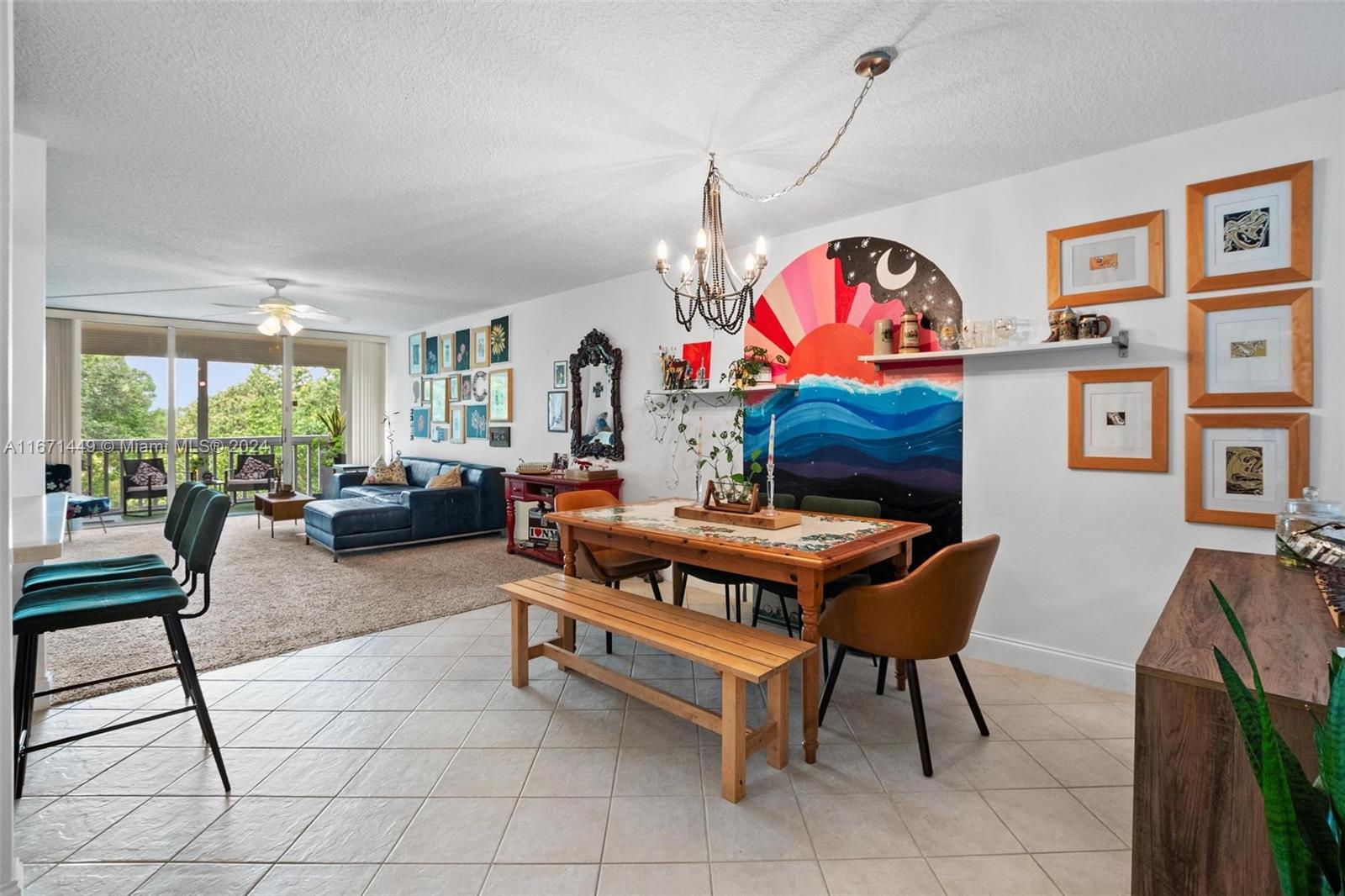 a living room with furniture a rug entryway and a window