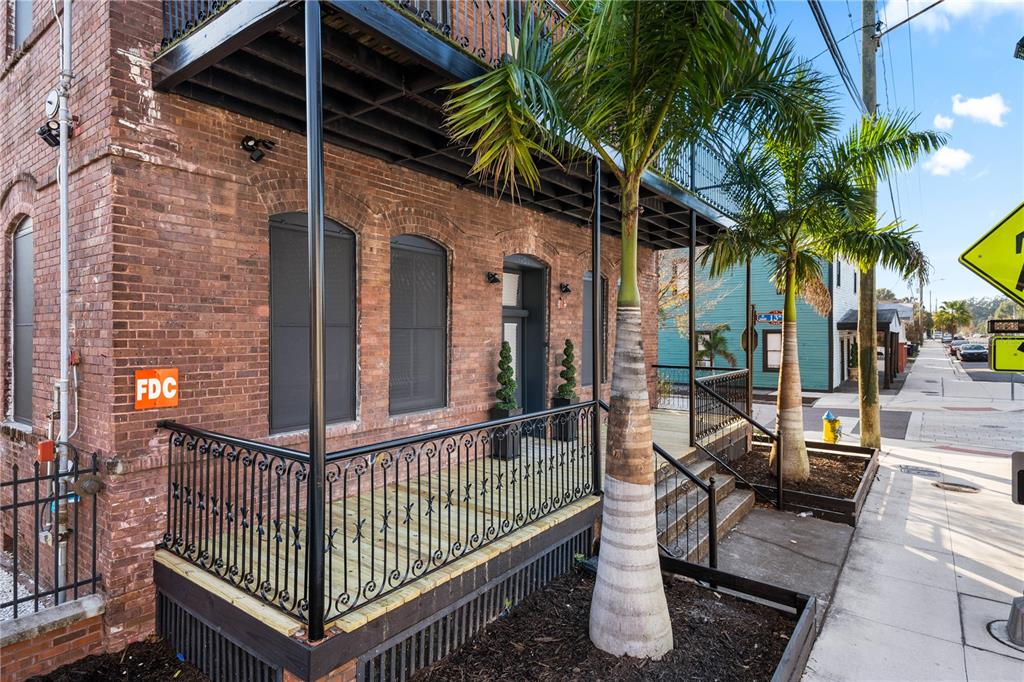 a view of balcony with small garden