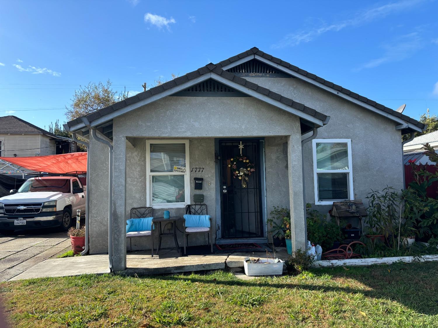 a front view of a house with garden