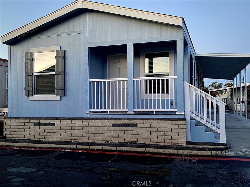 a view of a house with wooden deck