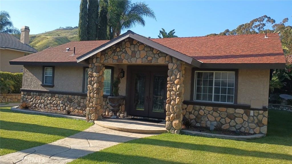 a front view of a house with garden