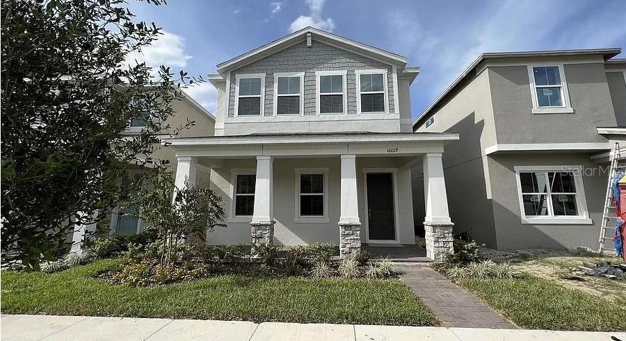 front view of a house with a yard