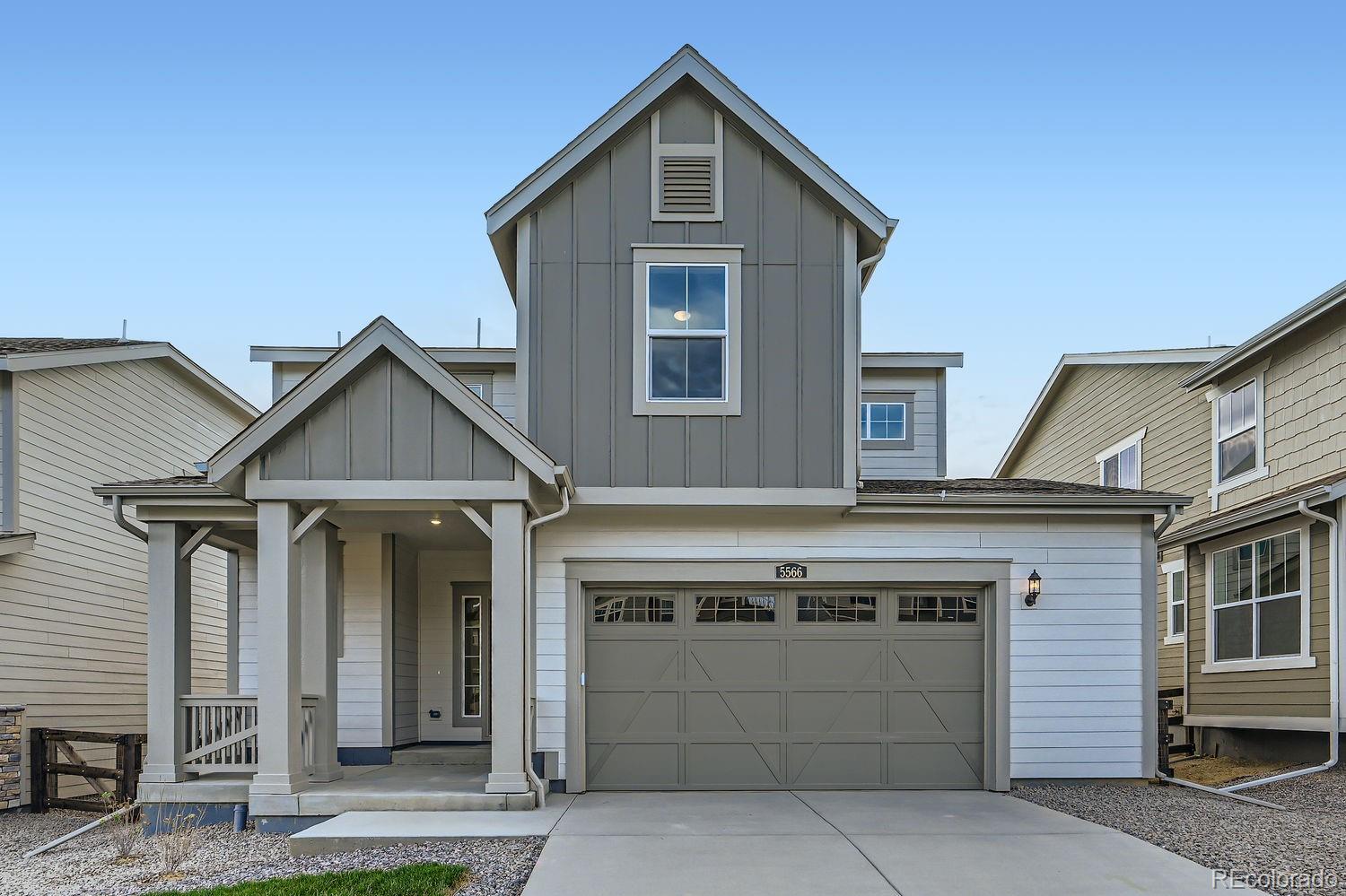 a front view of a house with a garage