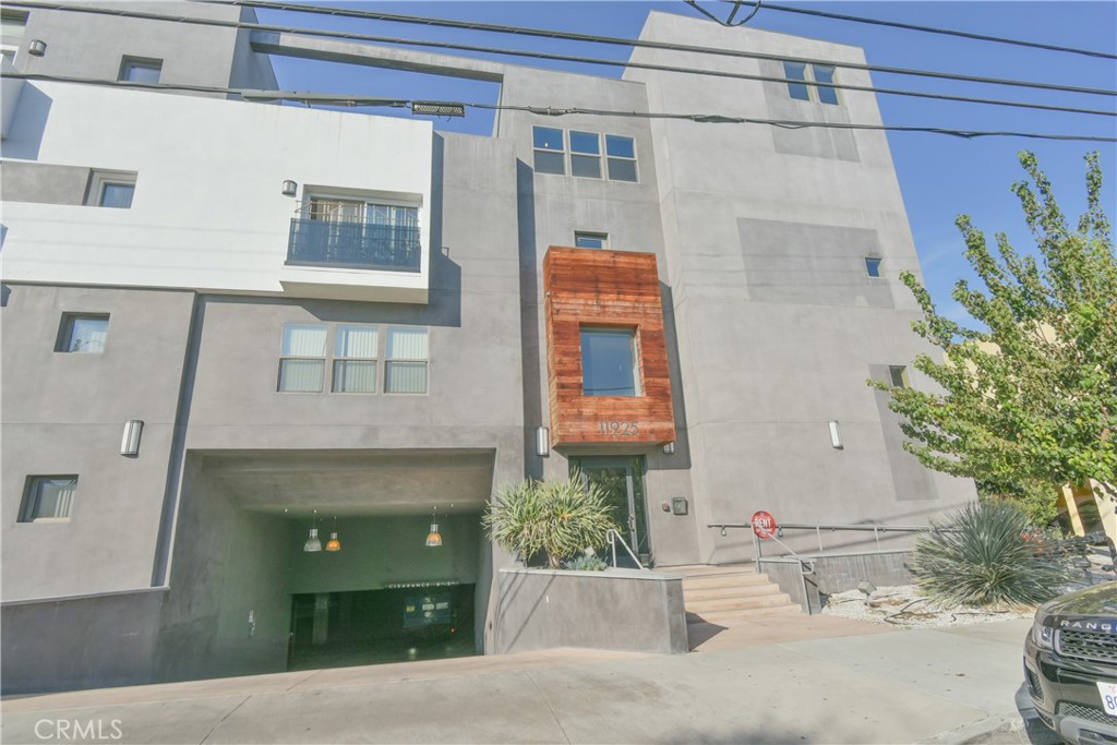 a front view of a house with a garage