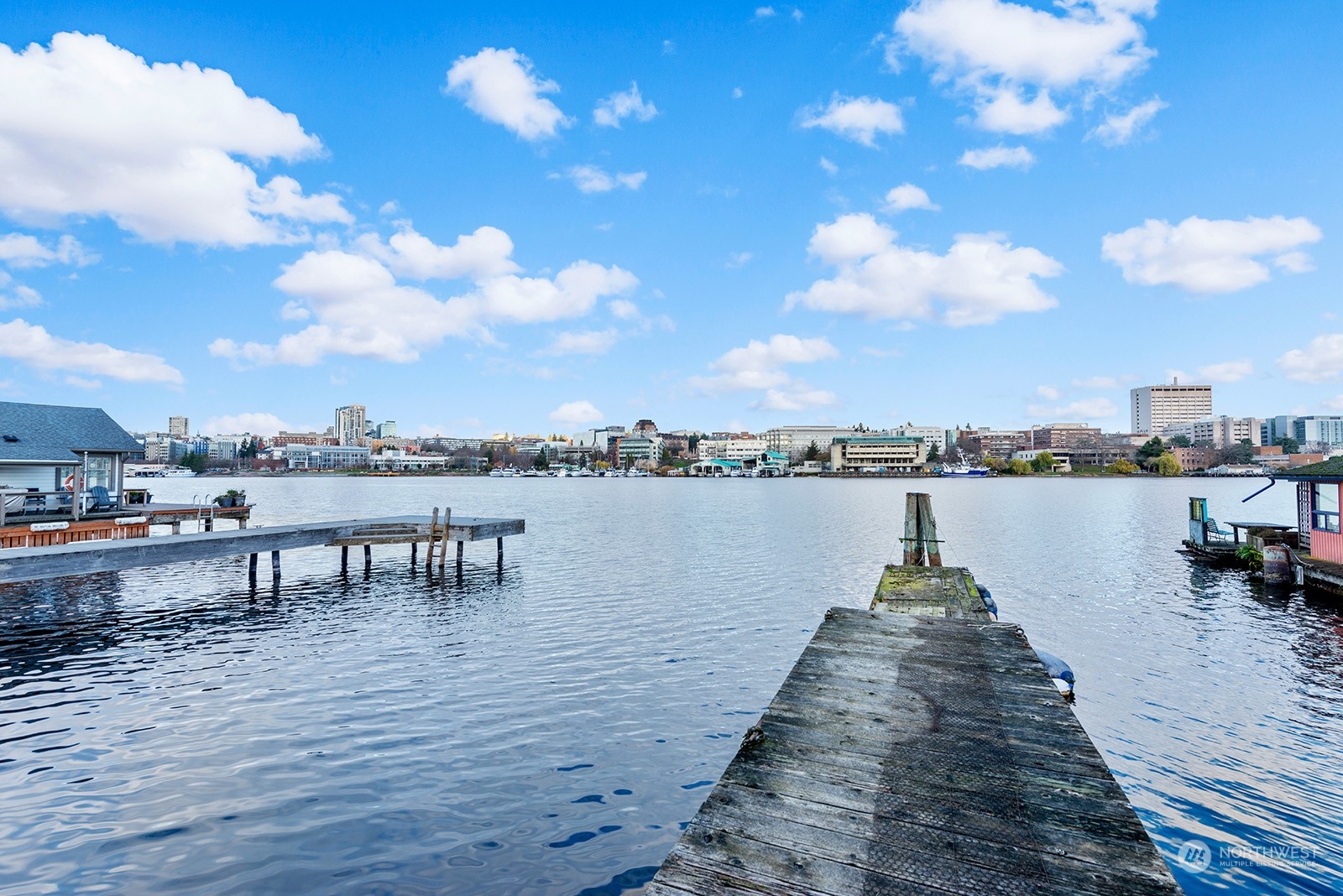 a lake view with tables and chairs