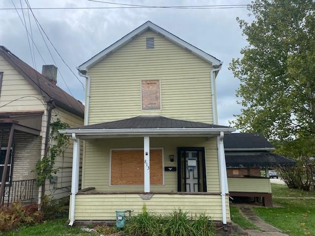 a view of a brick house with large windows