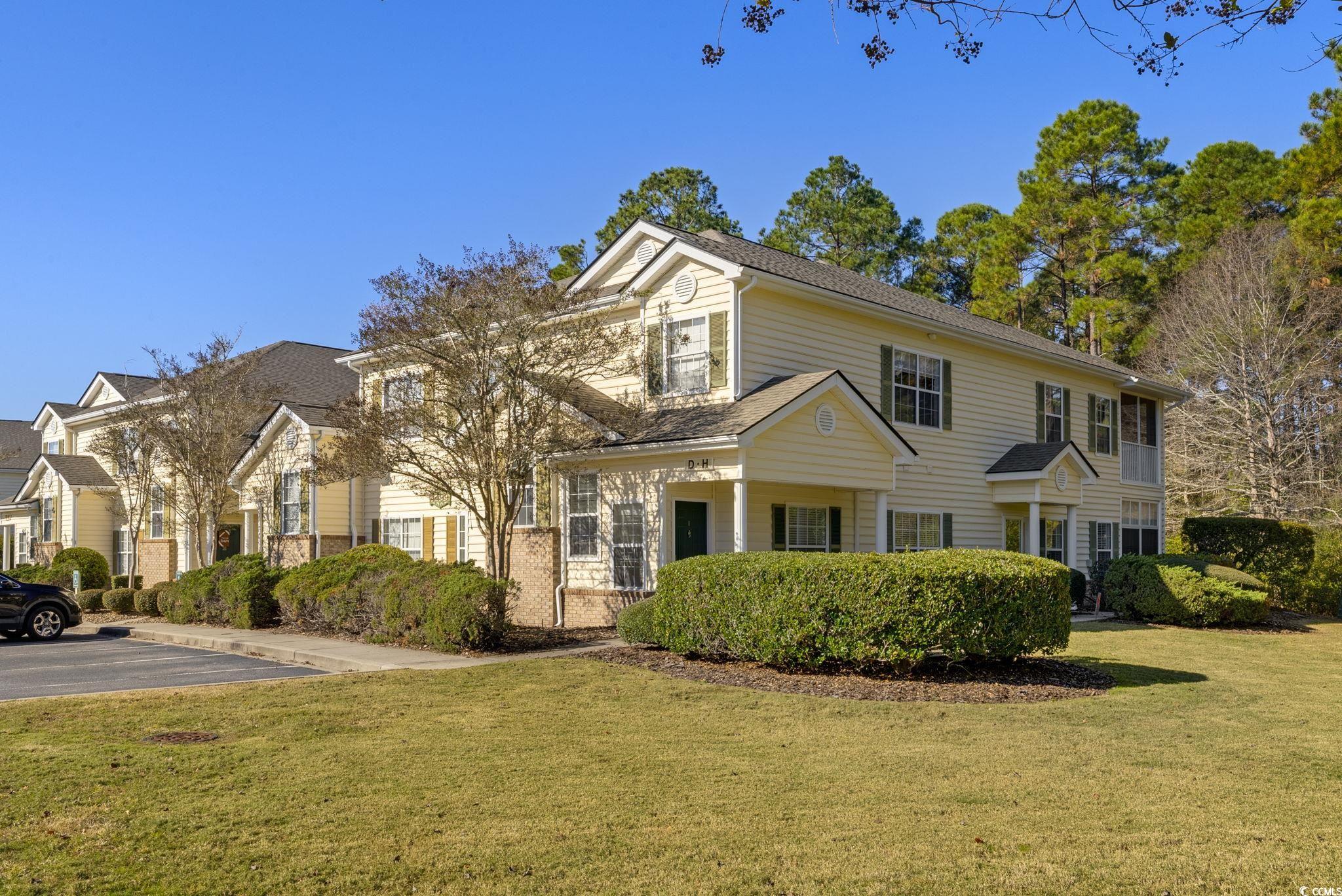 View of front of property with a front yard