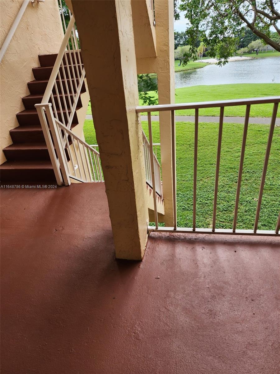 a view of an empty room with stairs