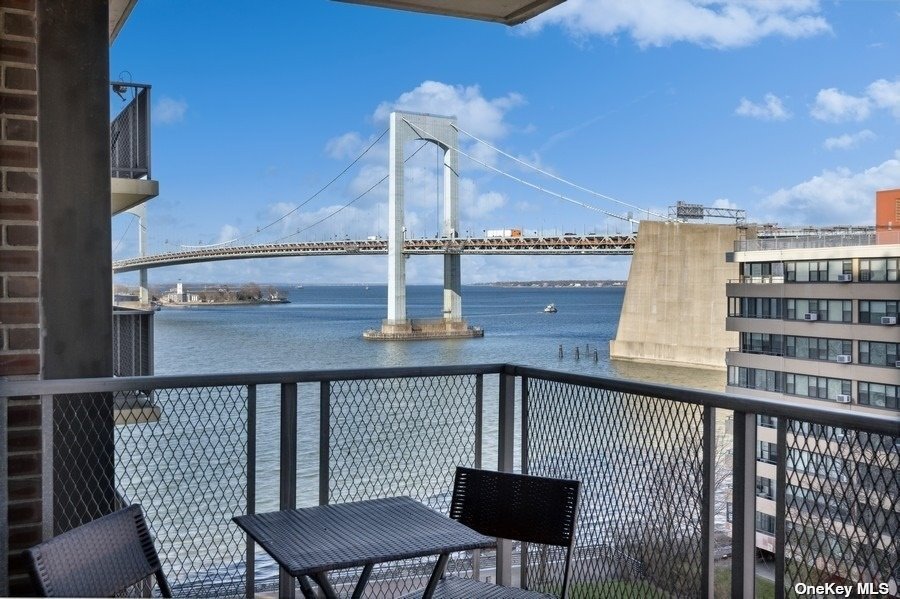 a view of a balcony with chairs