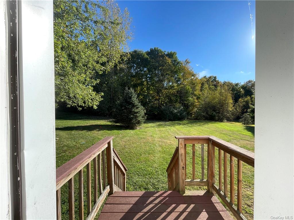 a view of balcony with yard