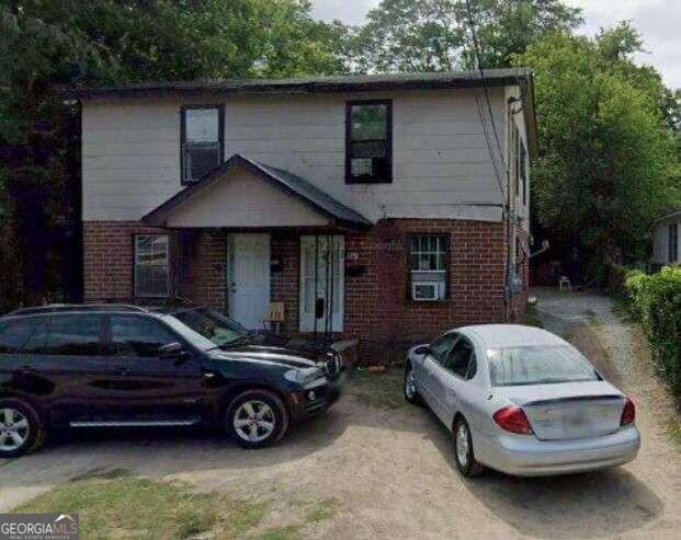 a car parked in front of a house