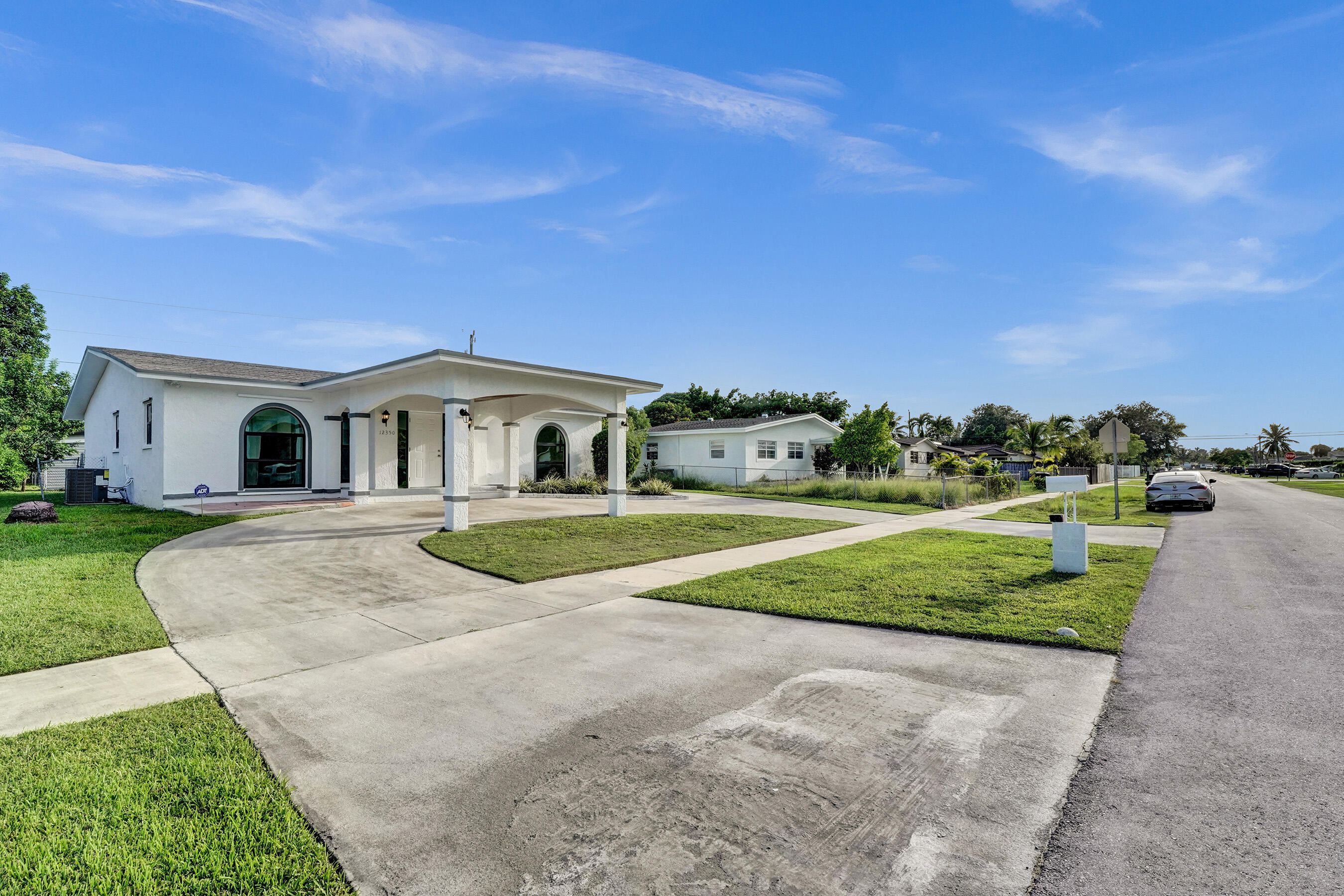 a view of house with outdoor space and street view