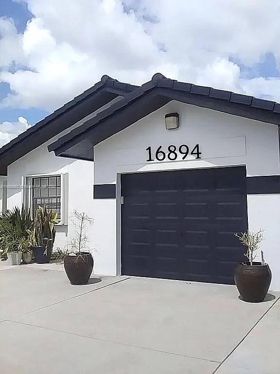 a view of entrance gate of a house