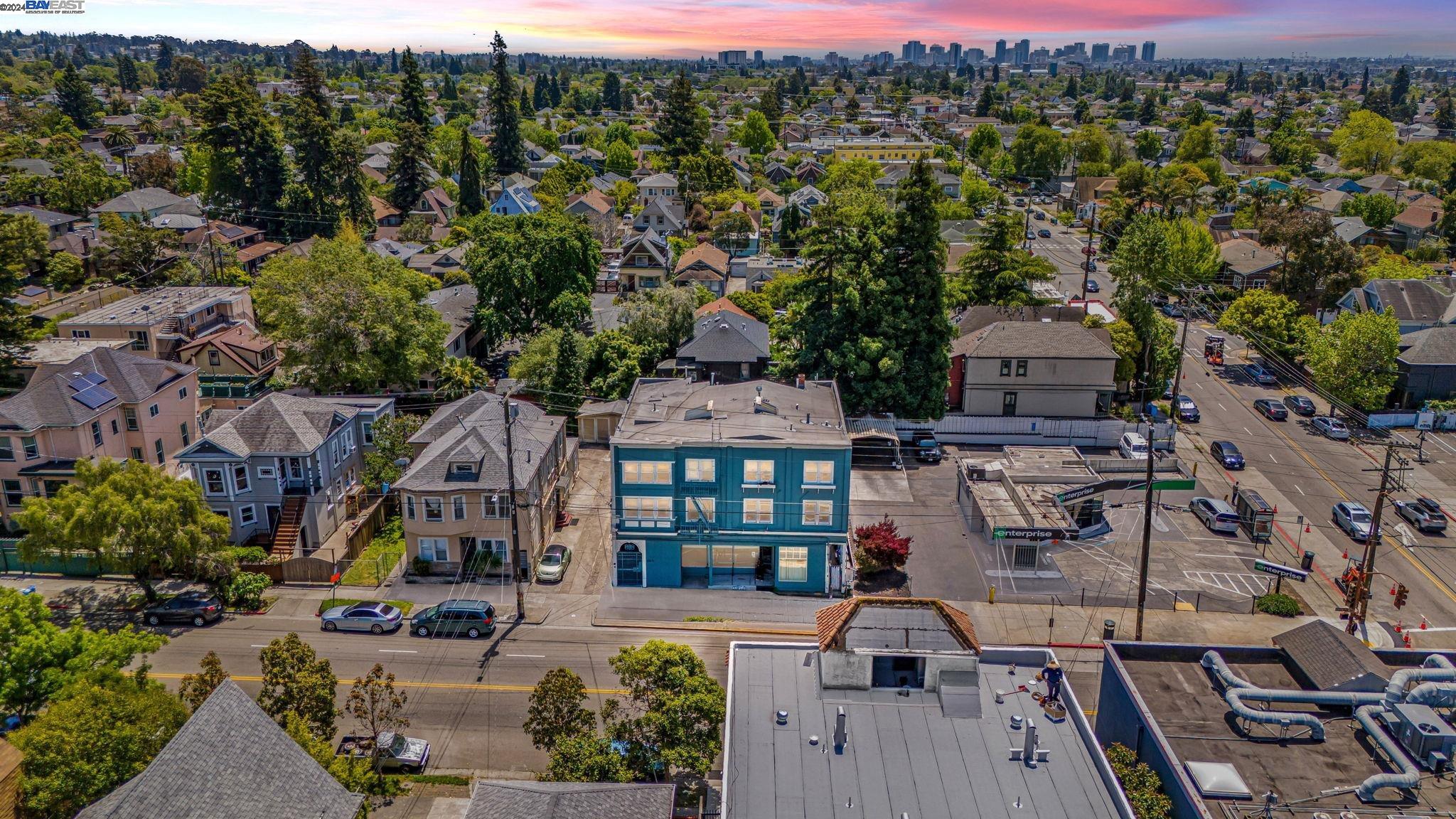 an aerial view of multiple houses with a yard