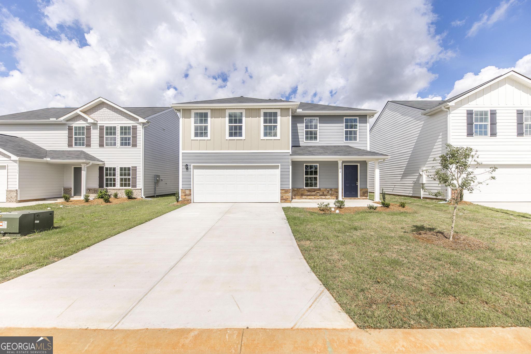 a front view of a house with a yard