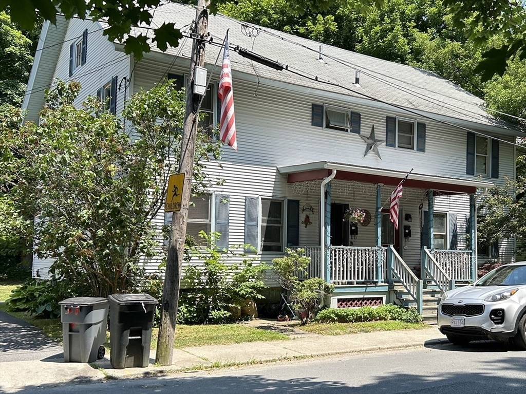 a view of a car park in front of house