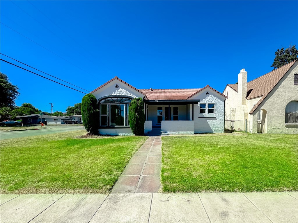 a front view of a house with a yard