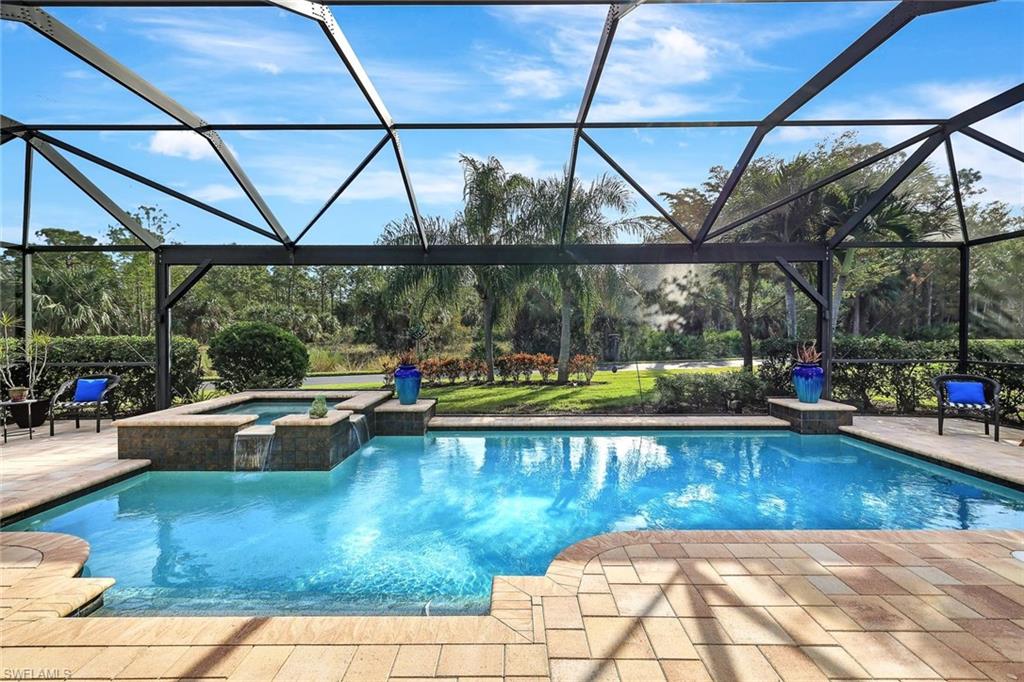 a view of swimming pool with seating space