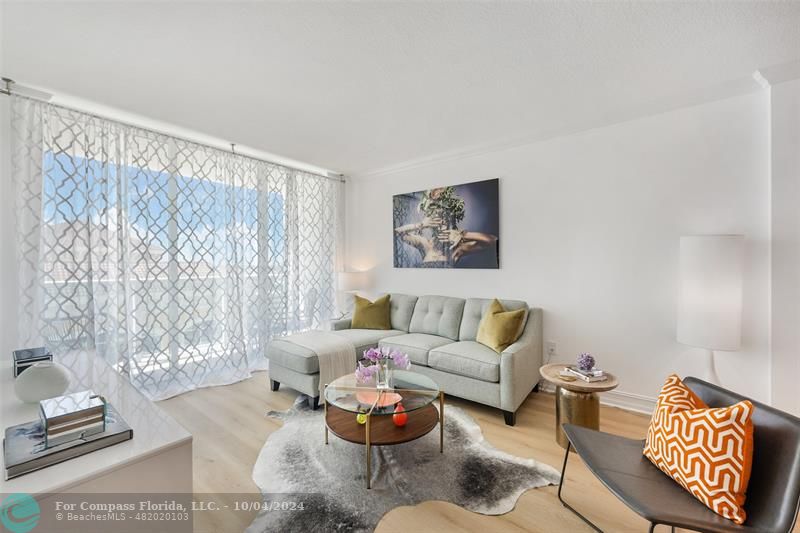 a living room with furniture and a window