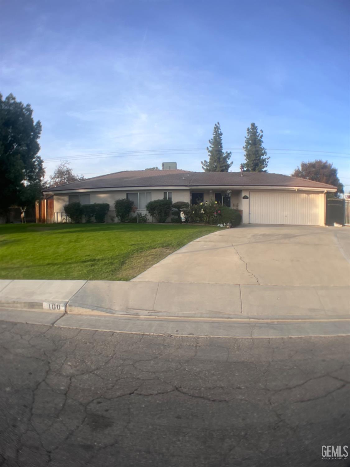 a view of a house with a yard and garage