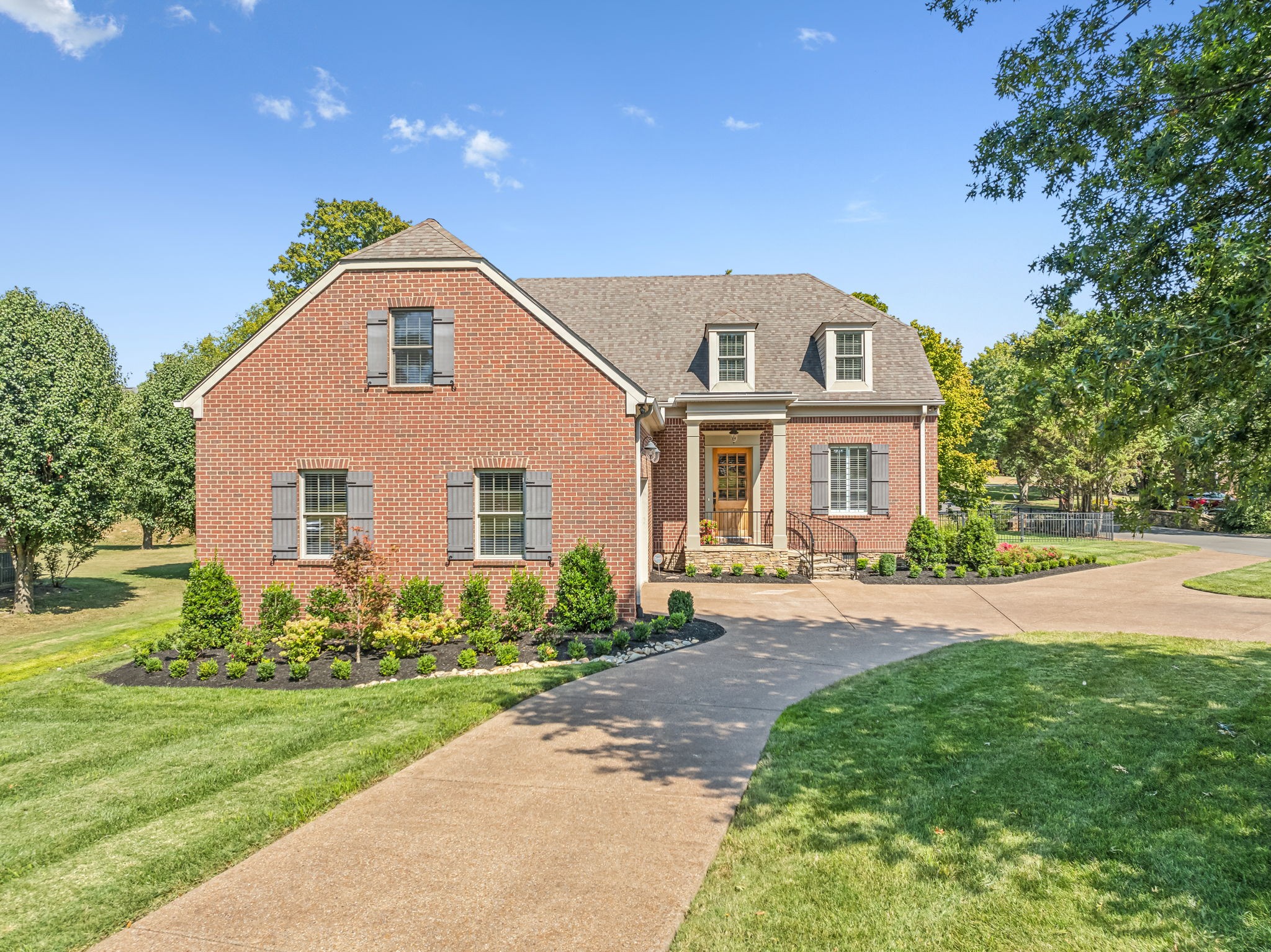 a front view of a house with a yard