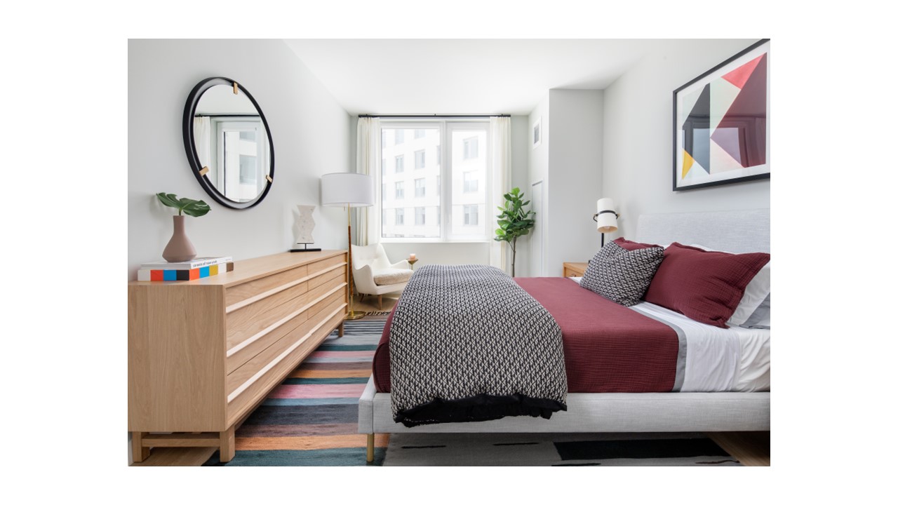 a living room with furniture a bathtub and a window