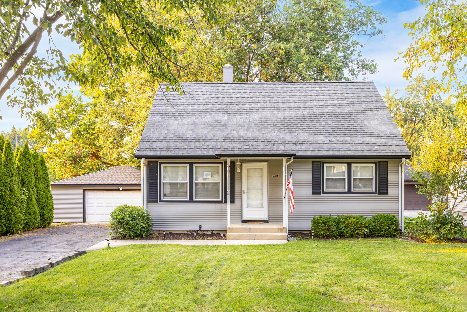 front view of a house with a yard