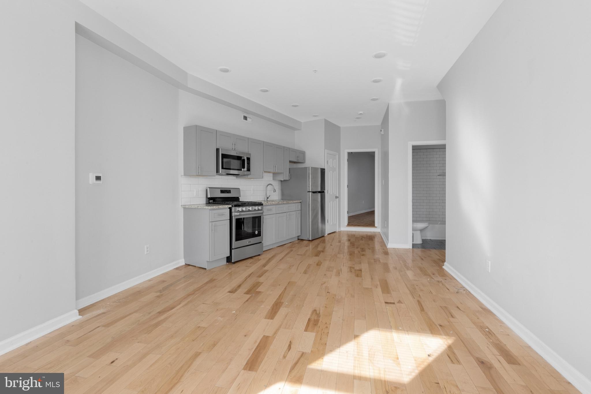 a view of kitchen with wooden floor