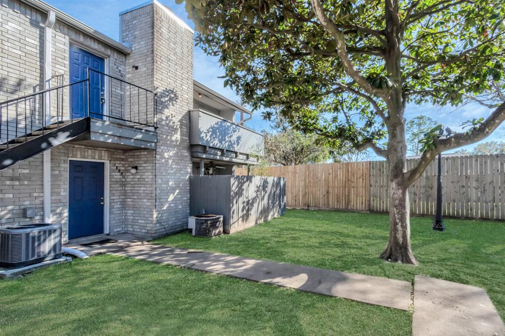 a view of a back yard of the house