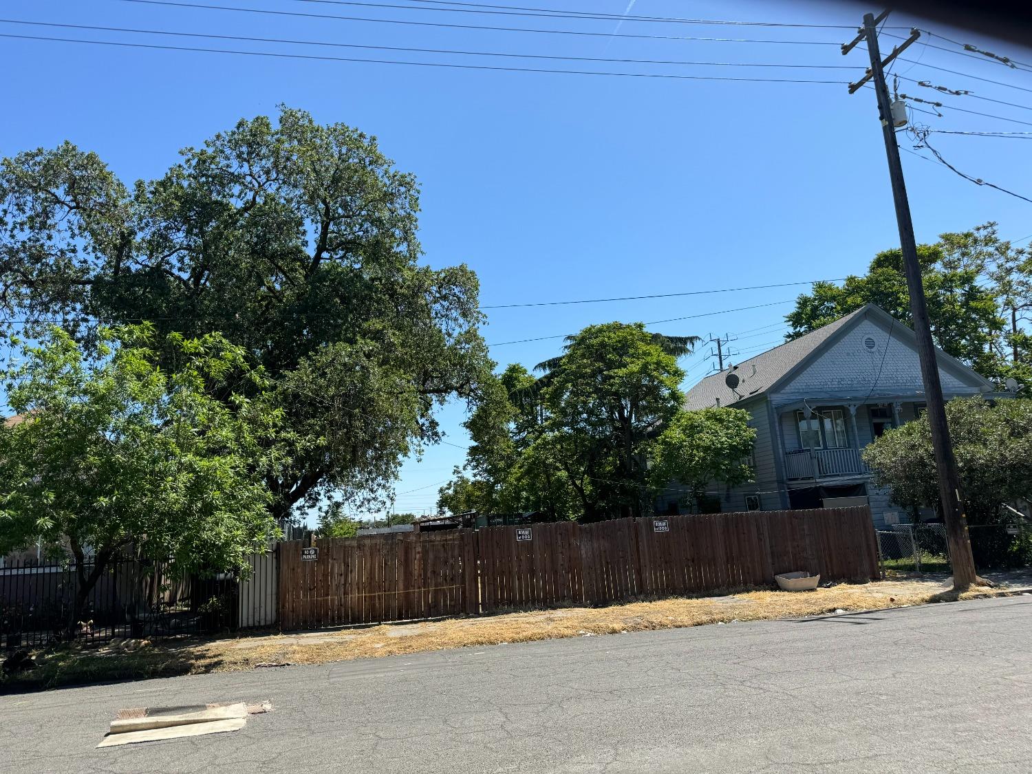 a view of a house with a wooden fence